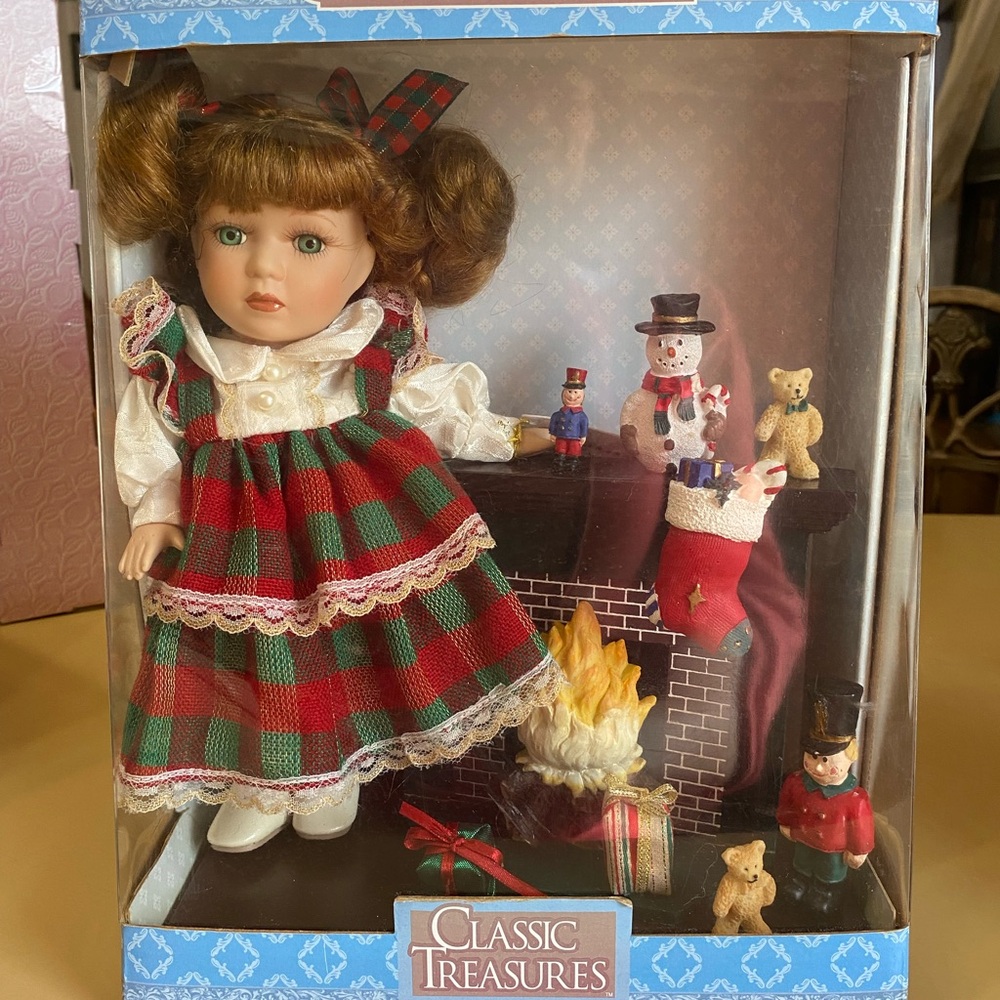 Classic Treasures 9” Porcelain Doll with Christmas accessories.